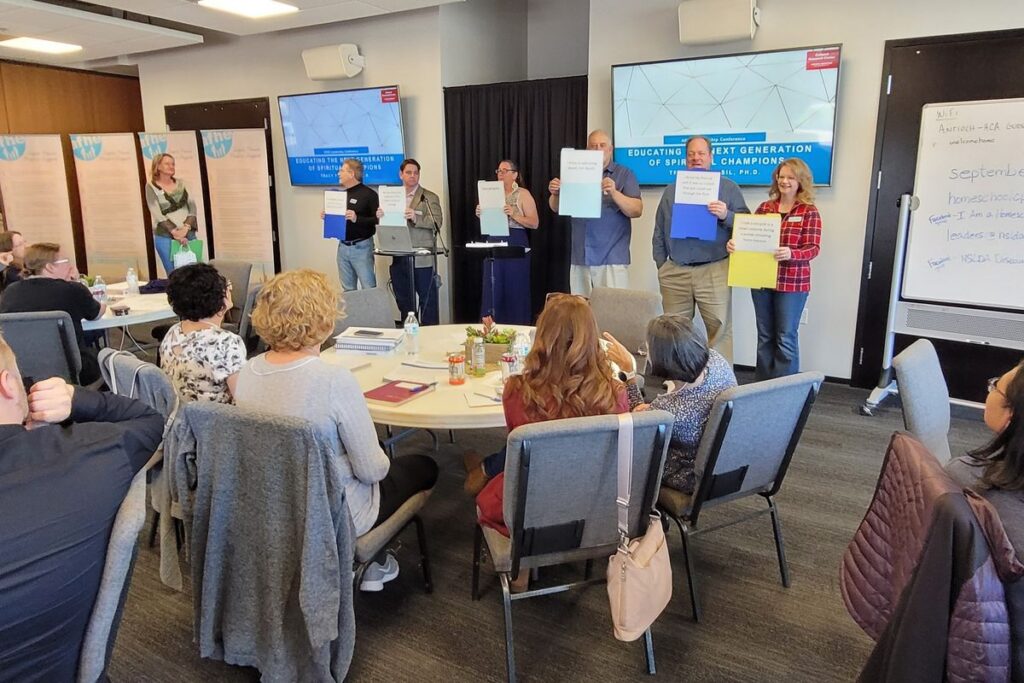 Homeschool leaders taking part in a group activity at the AFHE Leadership Conference